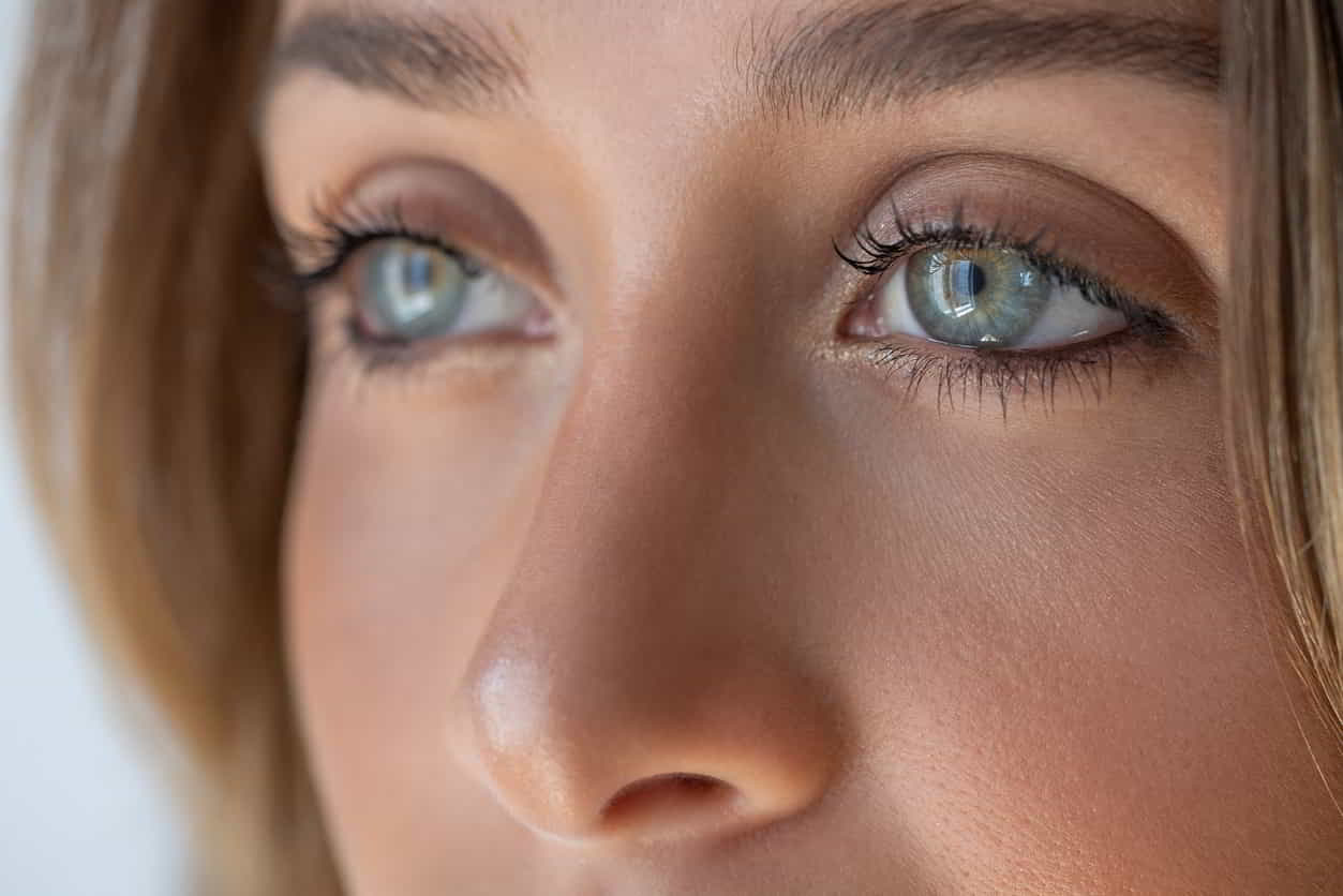 Close-up of a woman’s nose and face, representing nostril laser hair removal for visible hair around the nostril area.